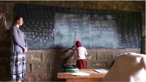 A child teaching math at Muruguma Primary School