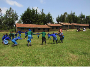 Mireyne playing a game with the children