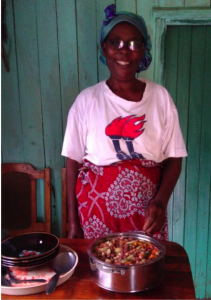 Salome (member of joy women’s group) besides her specially prepared githeri, which has more beans to increase protein and carrots and green leafy vegetables to increase β- carotene or vitamin A, folate and iron.