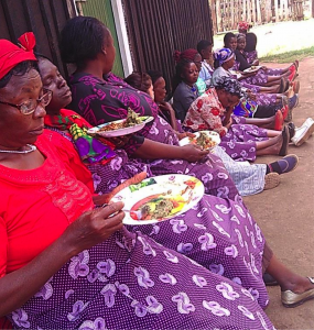 Women from Joy Women’s group enjoying super githeri and super mukimo that they prepared.